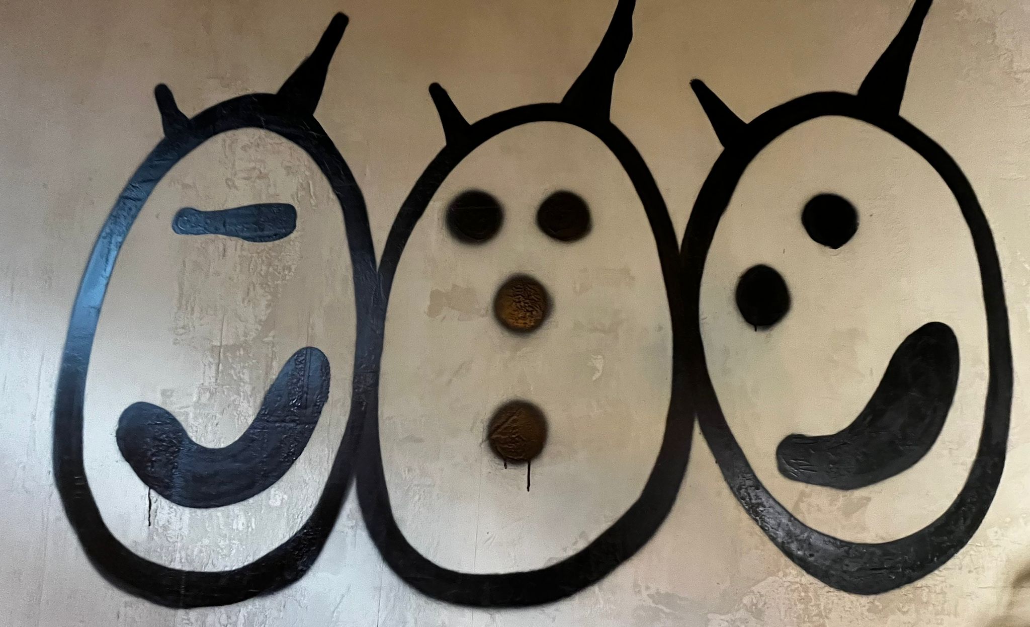 MOSTROS graffiti on a wall